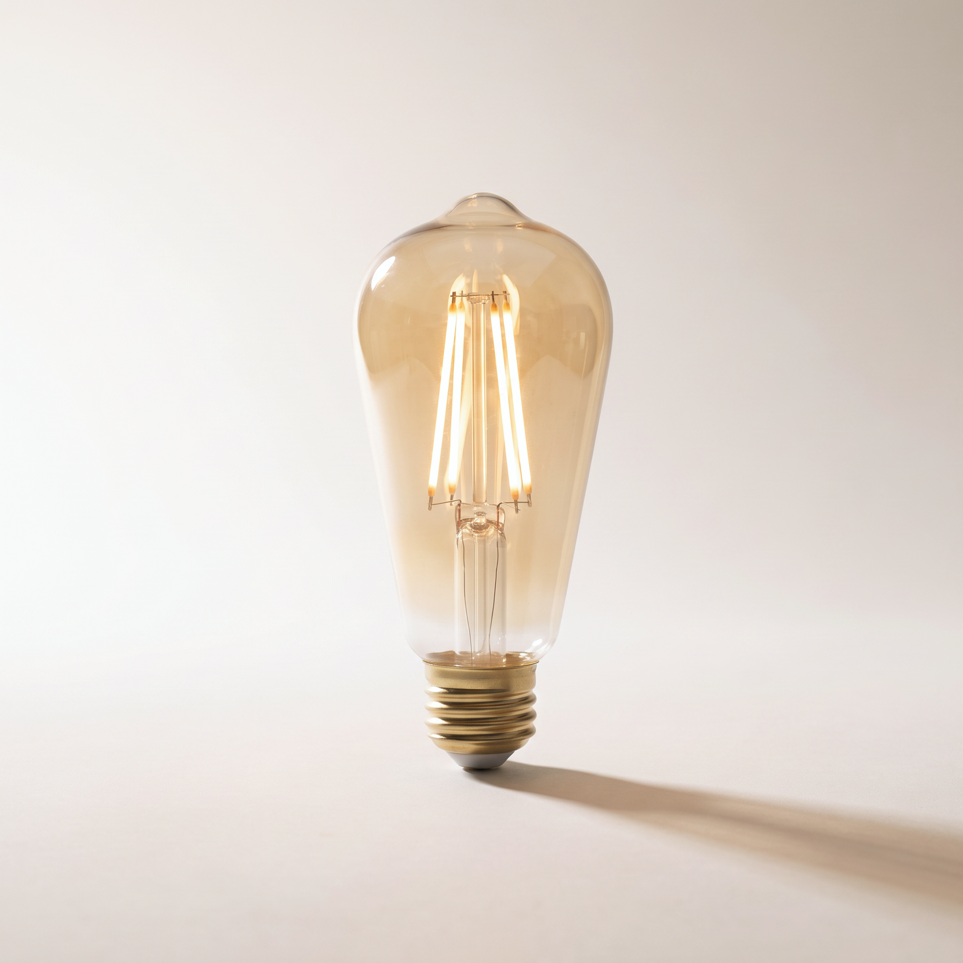 Xtricity LED Filament Type S Bulb — 5W / 120V / E26 / 400 Lumens / 2200K Soft White, Smoked Amber Glass, Dimmable (4-Pack)