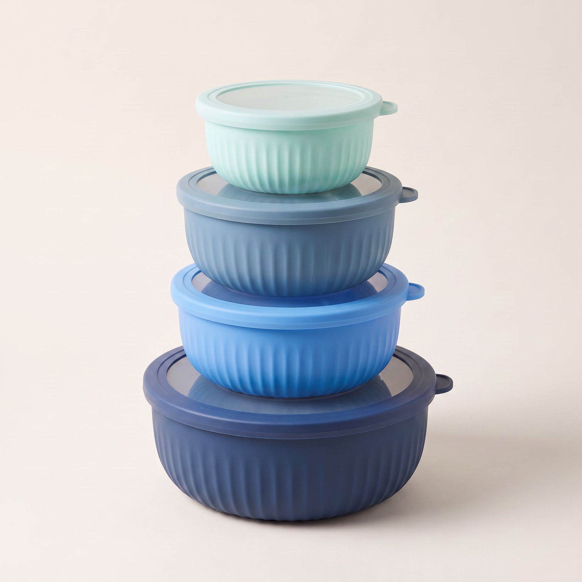 Set of 4 round nested food storage containers with clear-centre coloured lids