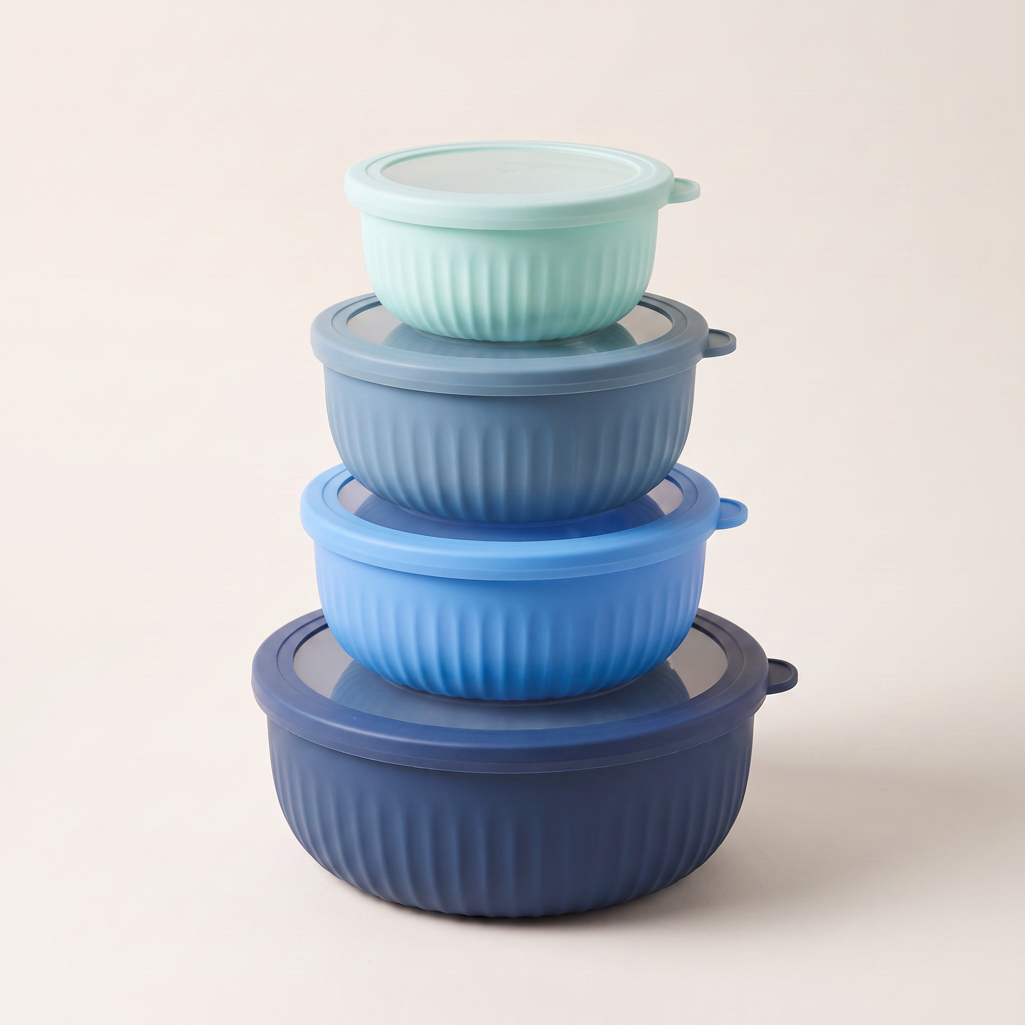 Set of 4 round nested food storage containers with clear-centre coloured lids